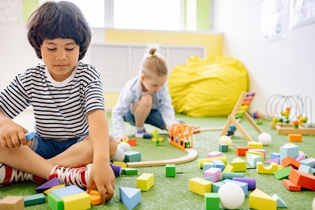 Kids playing with toys – one of the things that make your home look cluttered.