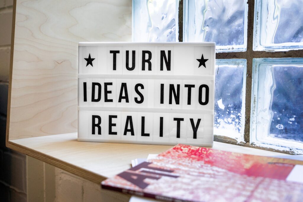 A sign that says: TURN IDEAS INTO REALITY