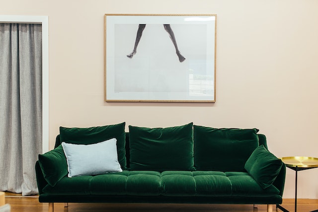 Display artwork in your room by placing it directly above furniture.