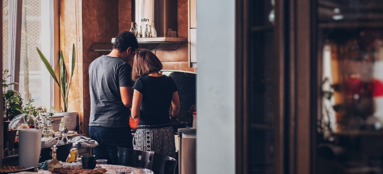 A couple in the kitchen.
