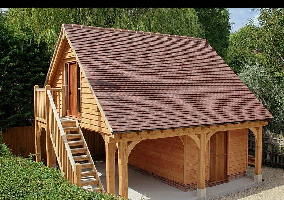 carport and garage with room above