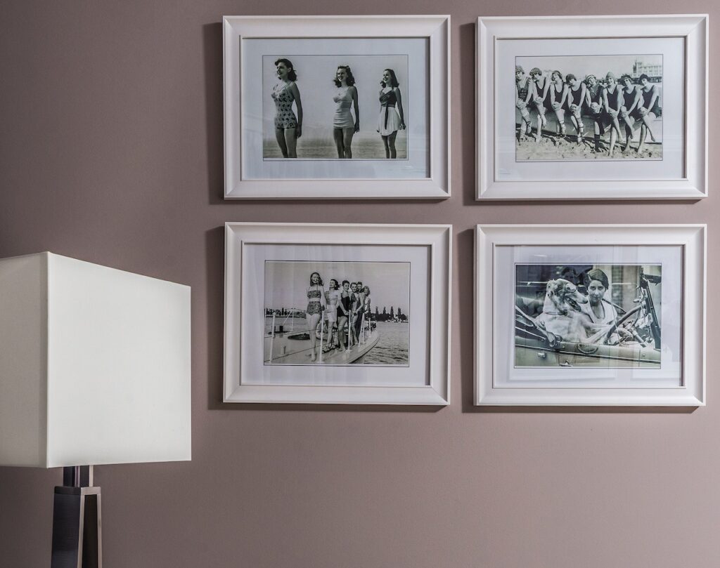 A gallery wall with old family photos, a genius way to add home decor for multigenerational living.