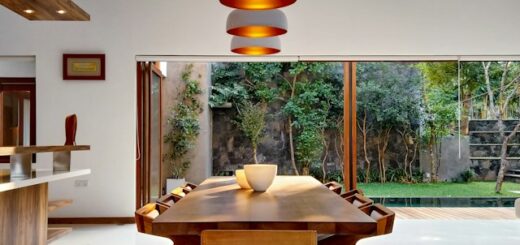 bright dining area overlooking green space outside